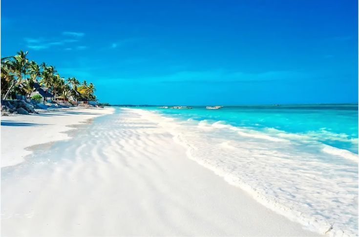 White sandy beach and turquoise waters in Zanzibar