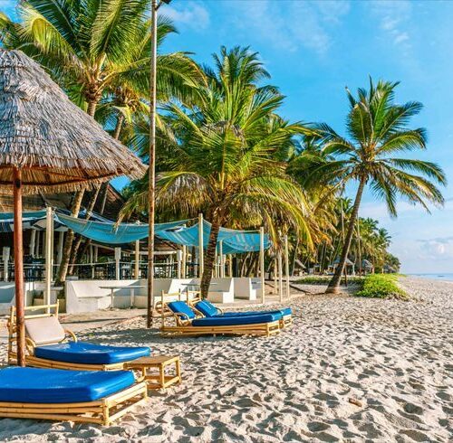 Aerial view of the white sandy beaches and turquoise waters of Diani Beach Kenya for our 3 Days Diani Flying Package