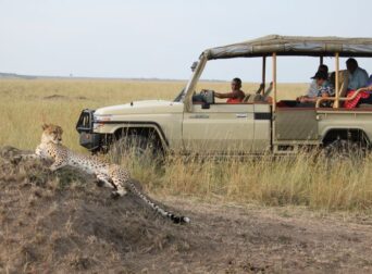 Safari vehicle exploring Maasai Mara National Reserve